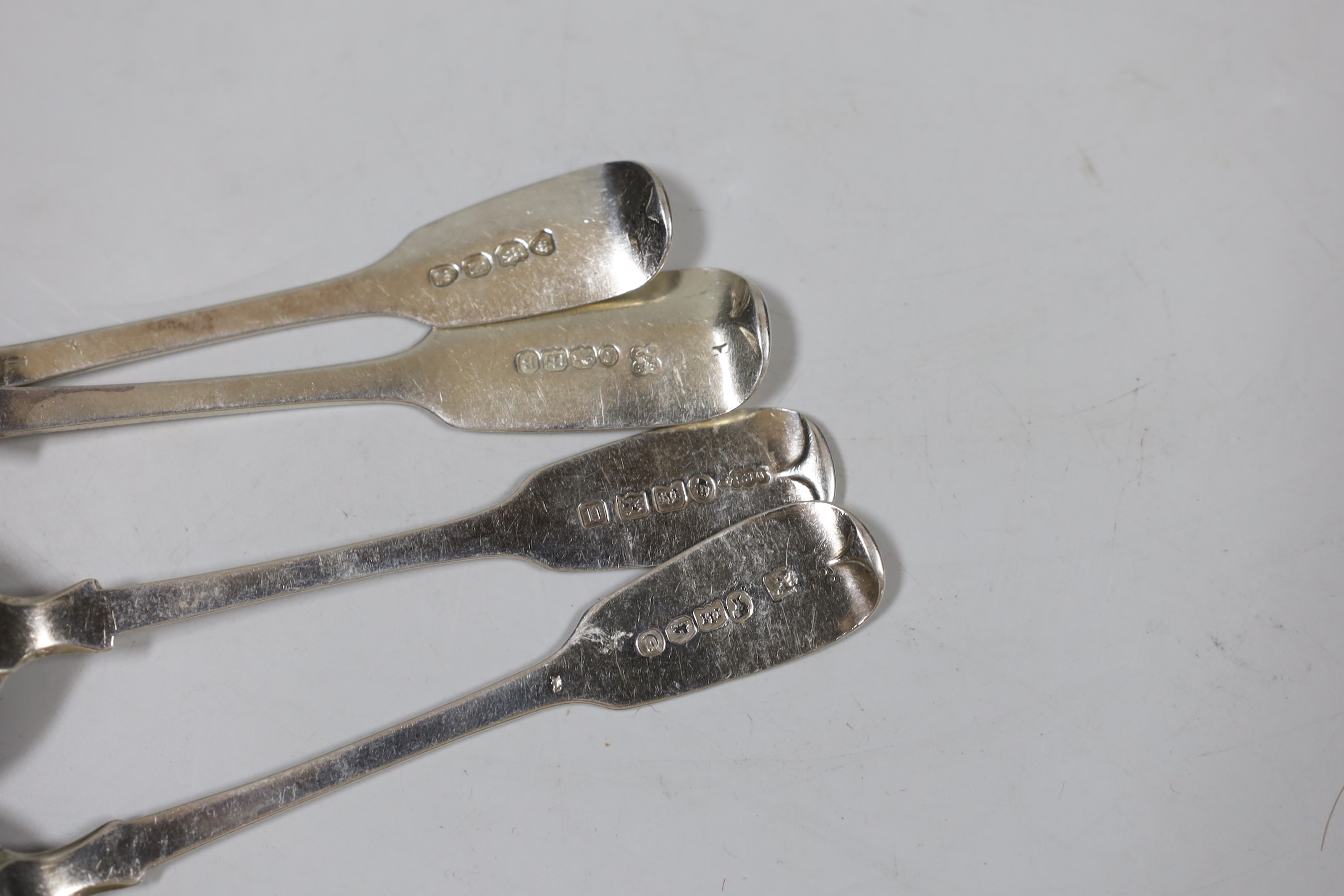 A harlequin set of twelve 19th century silver fiddle pattern teaspoons, various dates and makers, 7.6oz.